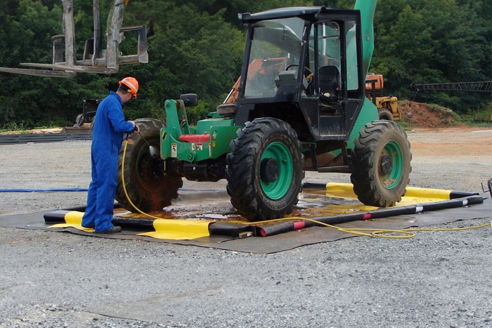 Rental-grade washdown berm used for cleaning industrial forklift