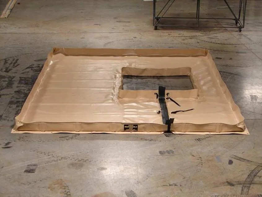 Custom, leakproof secondary containment berm with a square cutout